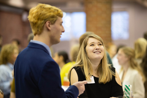 Students conversing at an Honors event