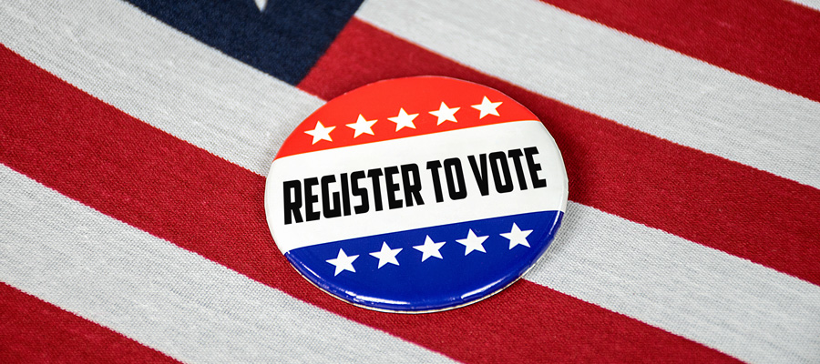 Register to Vote button sitting on the American Flag